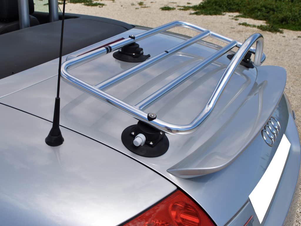silver audi tt convertible with a revo-rack stainless steel luggage rack fitted photographed from the side.