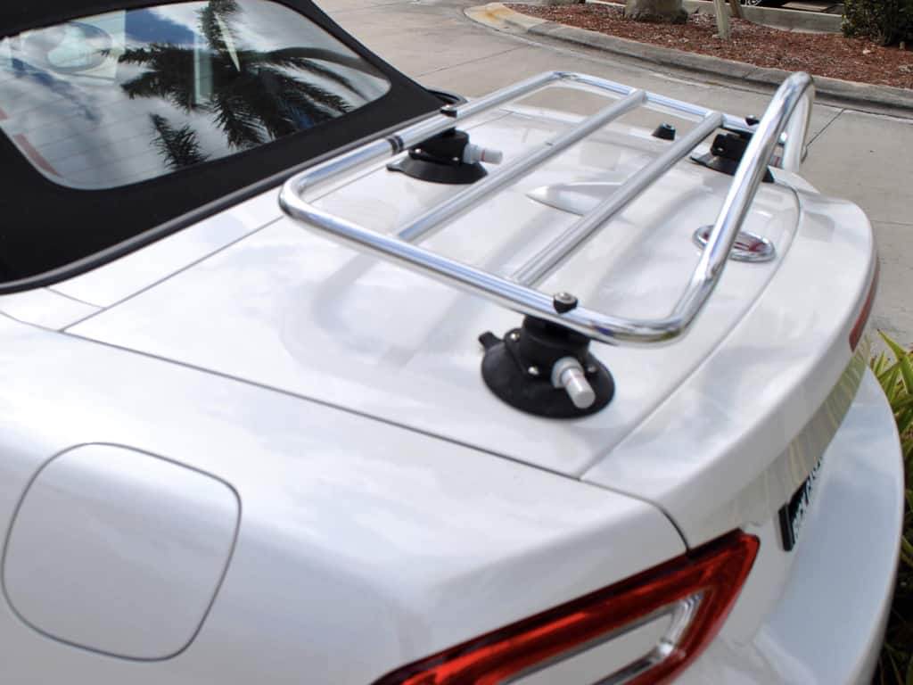 side view of a revo-rack pa luggage rack fitted to a white fiat 124 spider