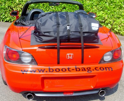 red honda s2000 hood down with a boot-bag original luggage rack fitted