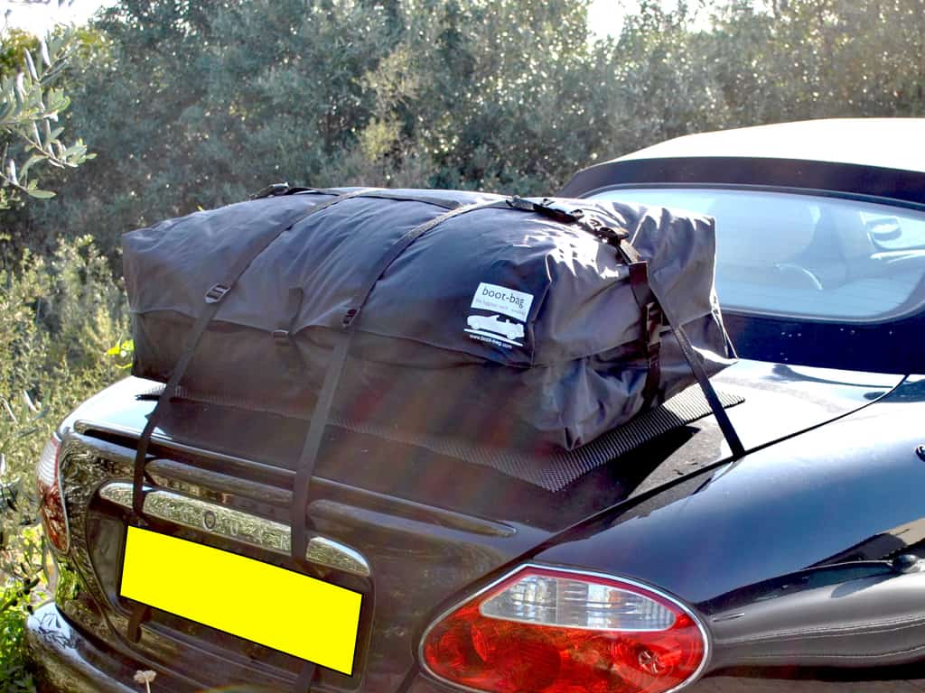 black jaguar xk with a boot-bag vacation luggage rack fitted 
