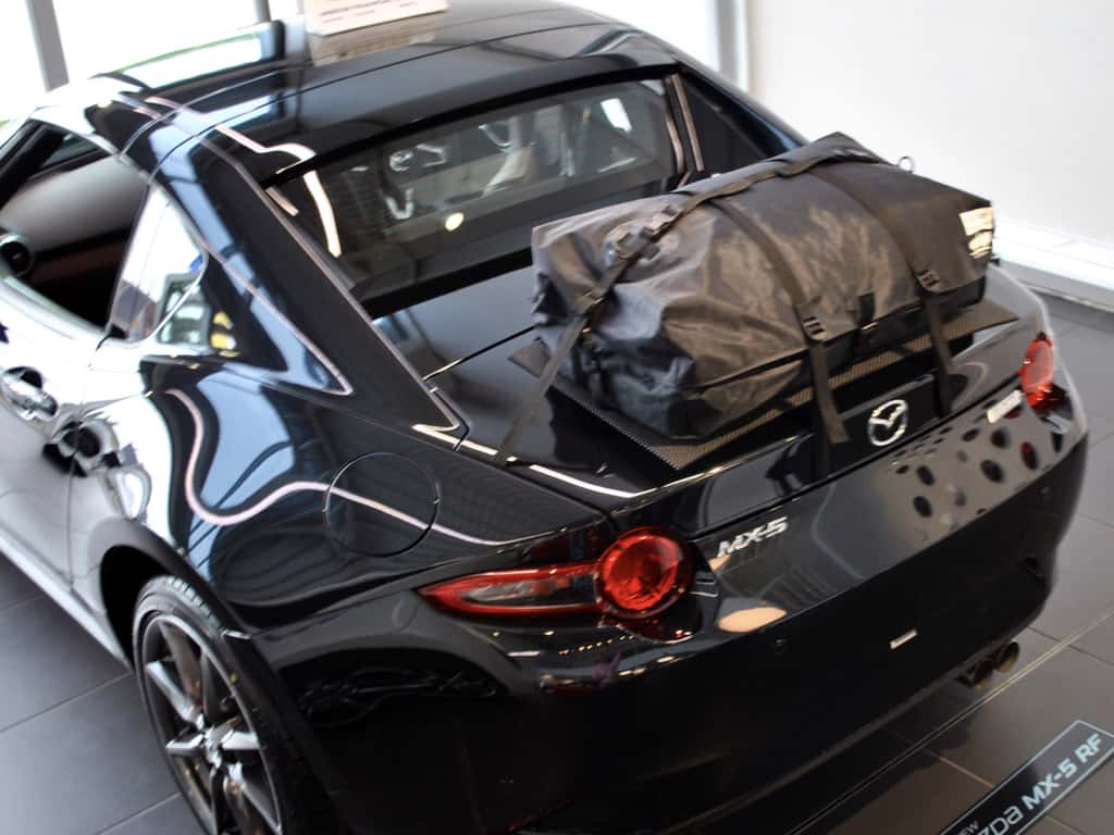 black mazda mx5 rf with a boot-bag original luggage rack fitted photographed from above
