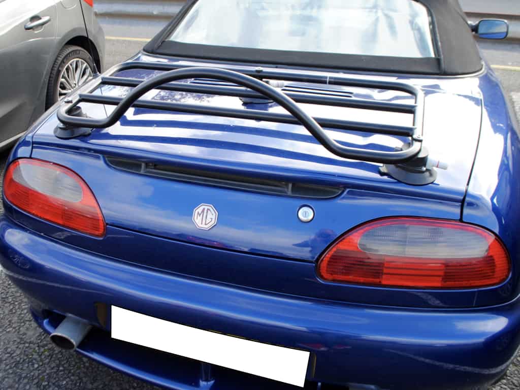 dark blue mgtf with a revo-rack black luggage rack fitted photographed from behind