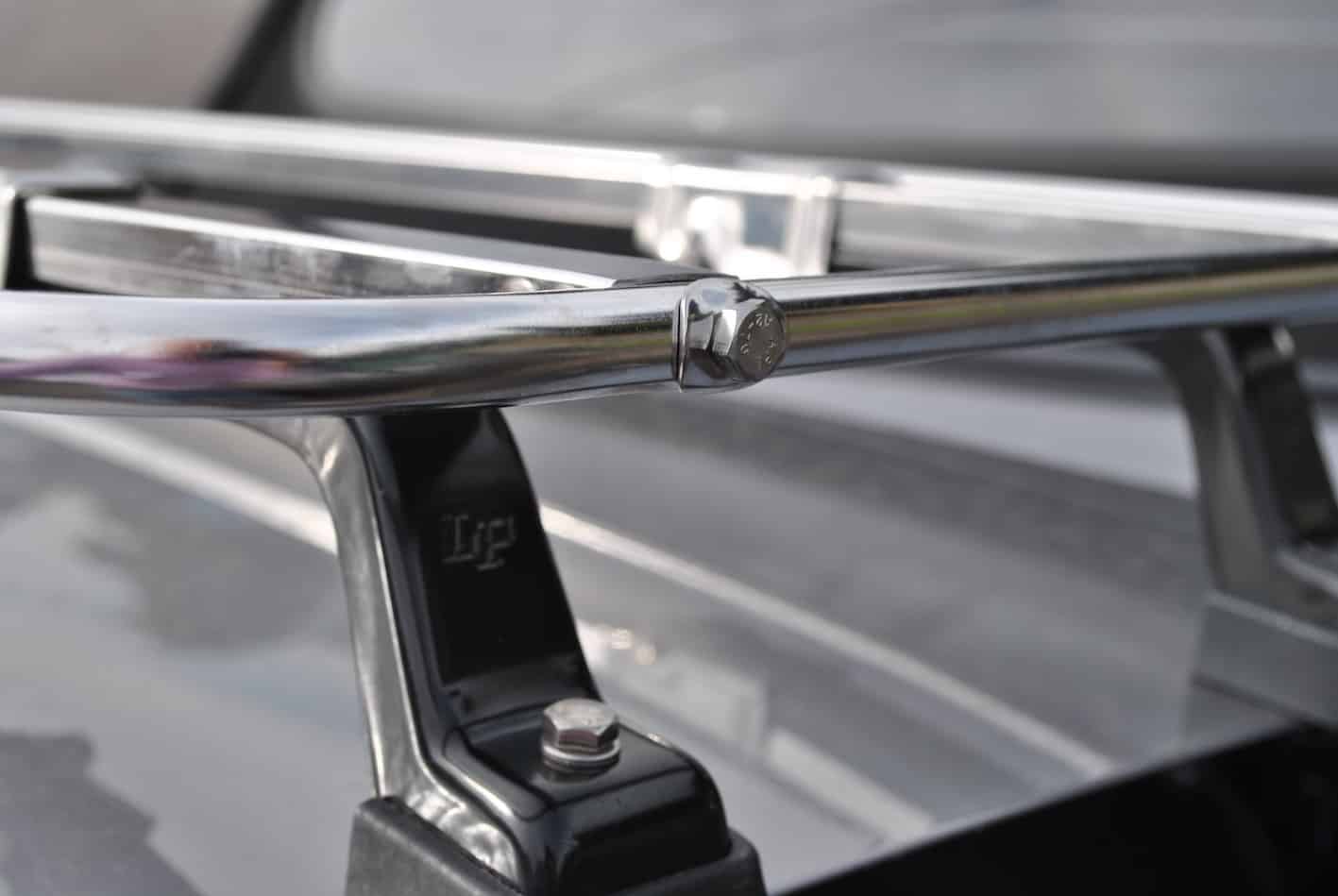 close up of the leg on a mazda mx5 stainless steel luggage rack