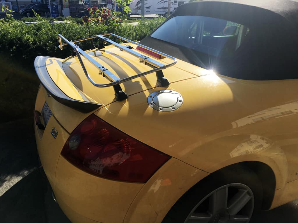 side view of a yellow 3.2v6 audi tt roadster with a stainless steel luggage rack fitted 