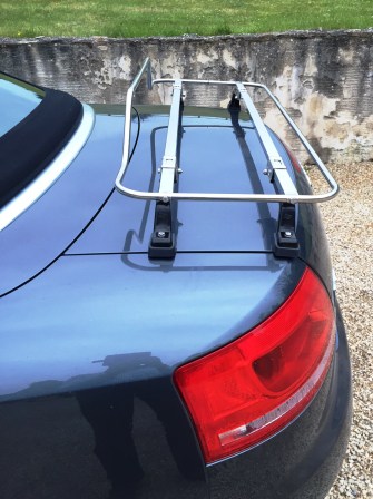 side view of an audi a4 convertible with a stainless steel luggage rack fitted