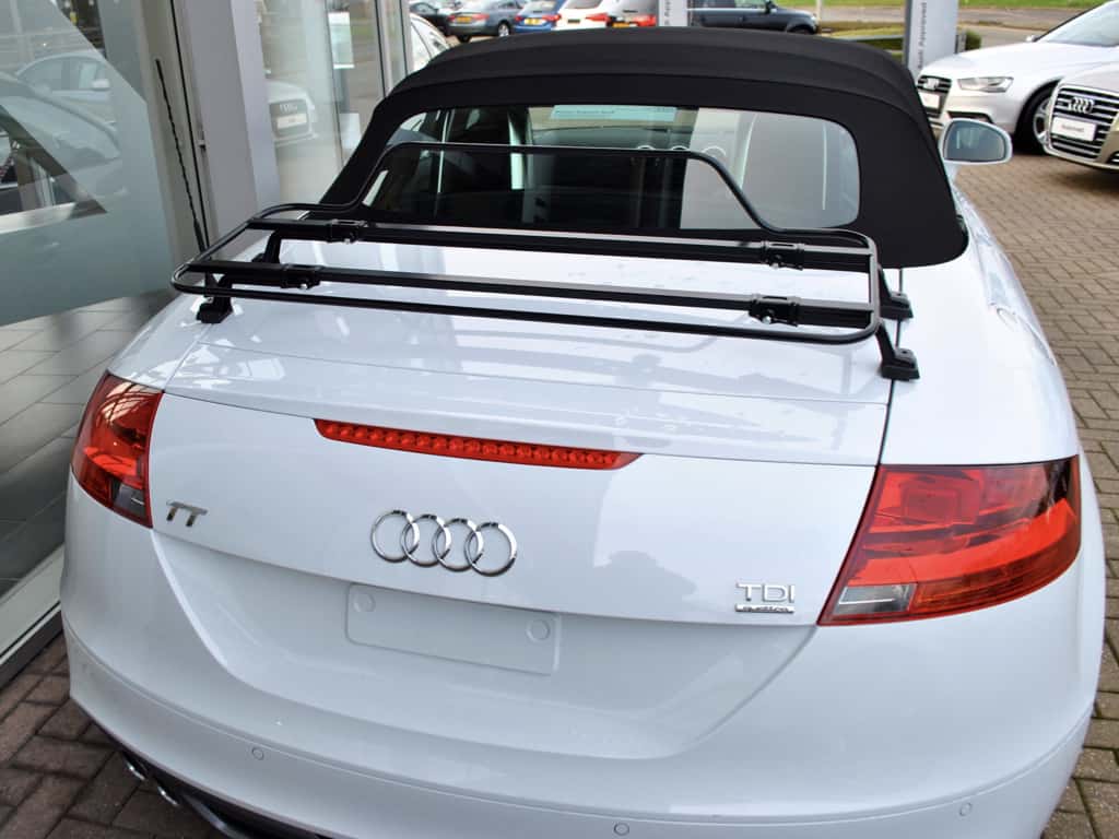 white audi tt mk2 roadster with the hood up and a black luggage rack fitted 