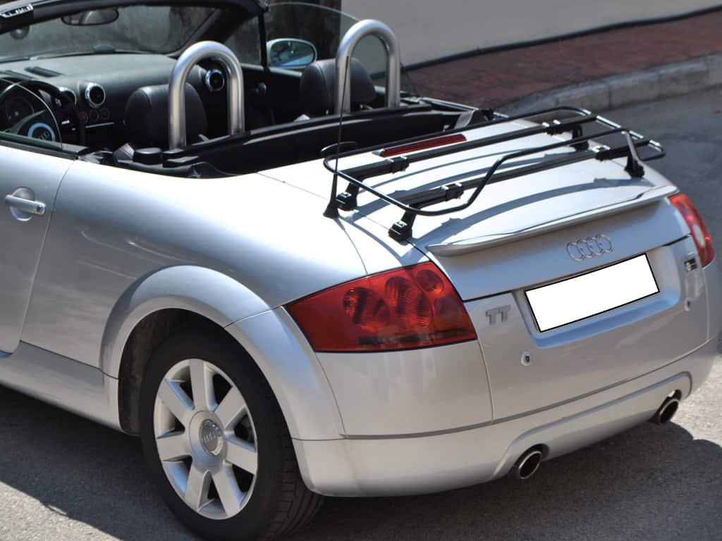 silver audi tt mk1 convertible with the hood down and a black luggage rack fitted