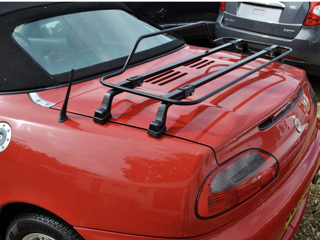 black luggage rack fitted to a red MGF photographed from the side 