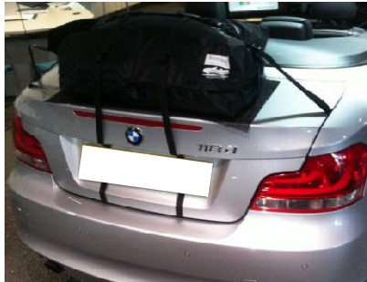silver bmw 1 series with a boot-bag original luggage rack fitted