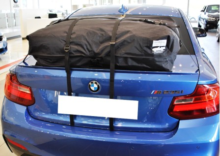 blue bmw m235i coupe with a boot-bag vacation luggage rack fitted