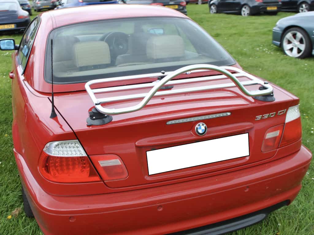 red bmw 3 series e46 convertible with a hardtop fitted and a revo-rack pa luggage rack on the boot