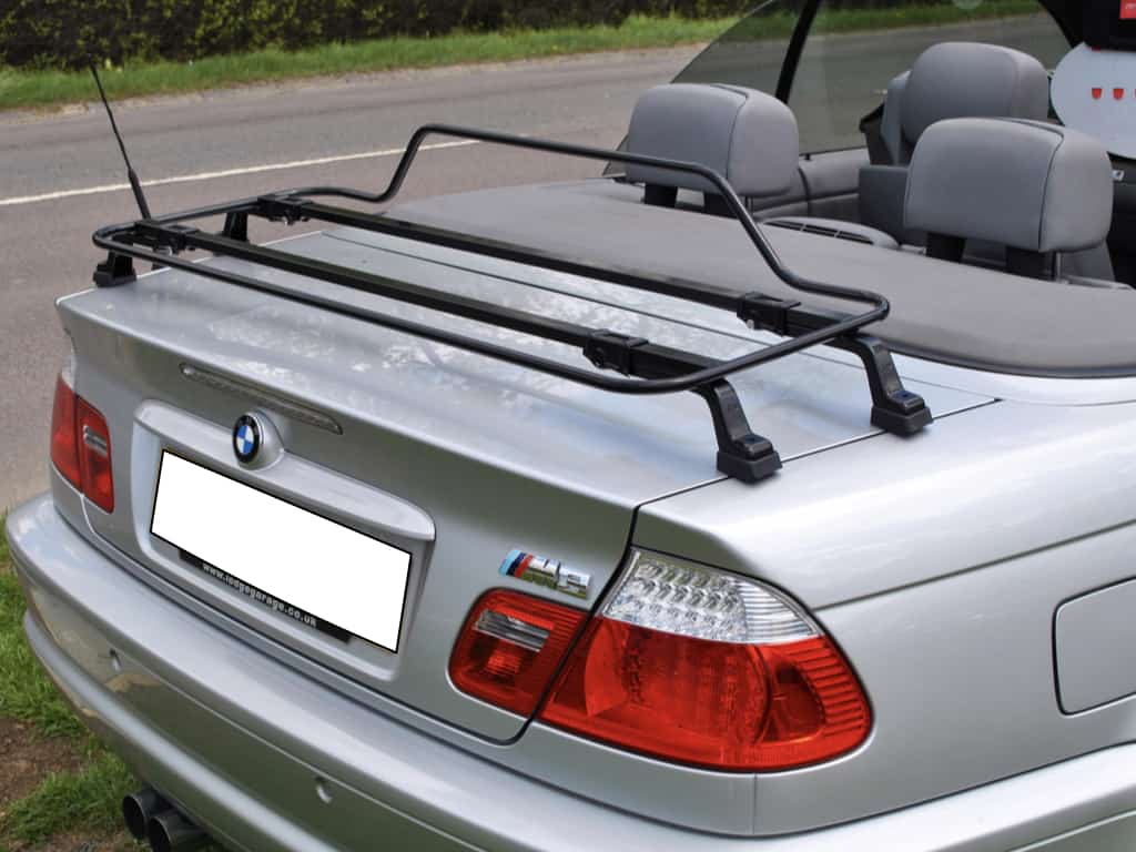 silver bmw 3 series e46 with the hood down and a black luggage rack fitted to the boot