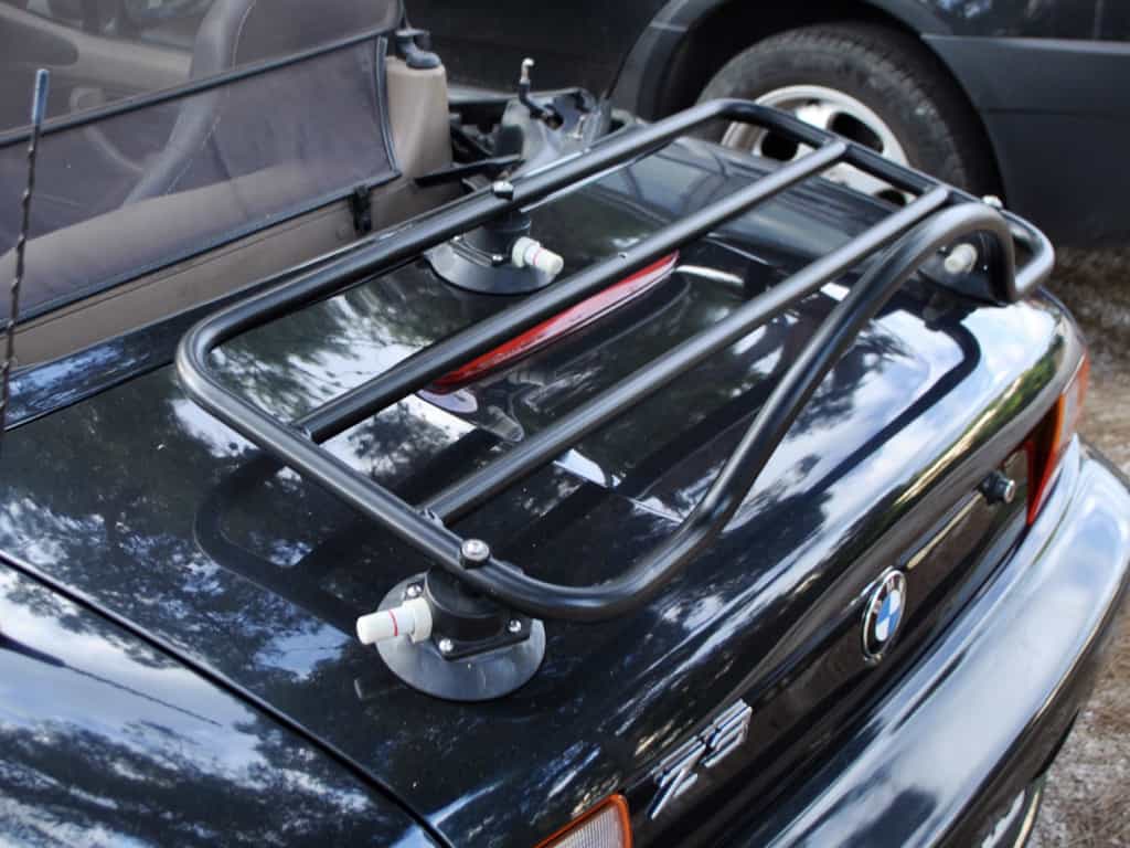 black bmw z3 with a black luggage rack fitted.