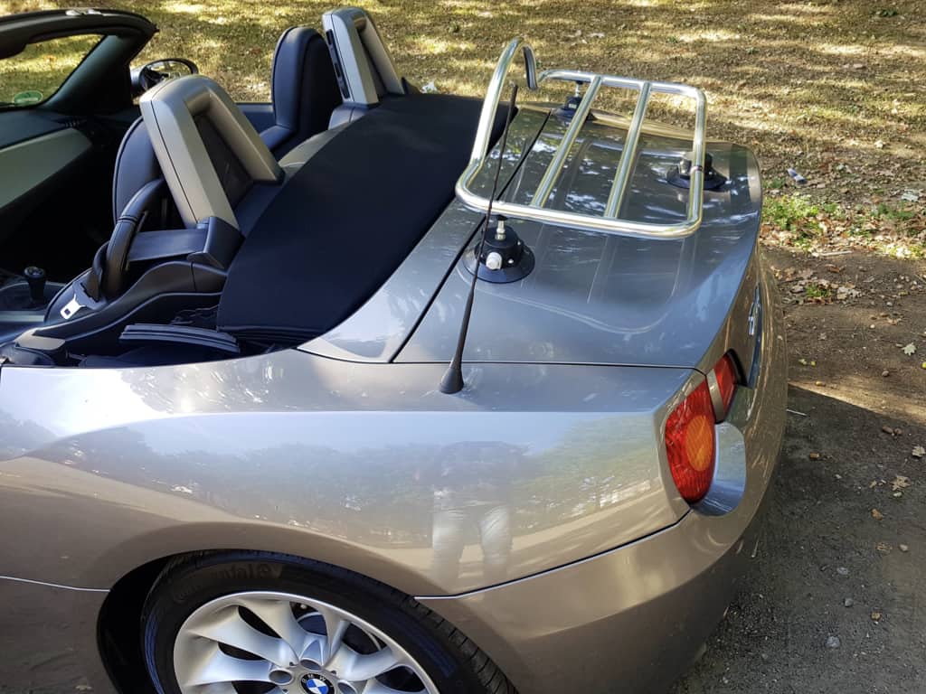 silver E85 2002-08 bmw z4 with a chrome luggage rack fitted