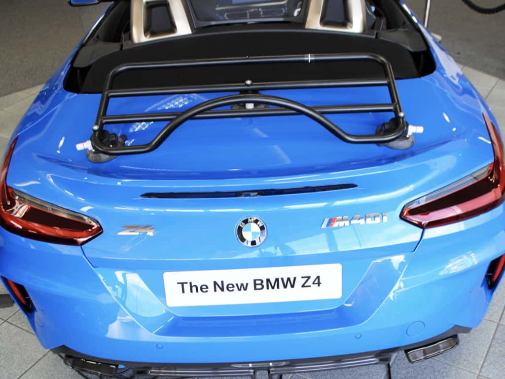 bmw z4 g29 M40i 2019 model in bright blue with the hood down and a black luggage rack fitted