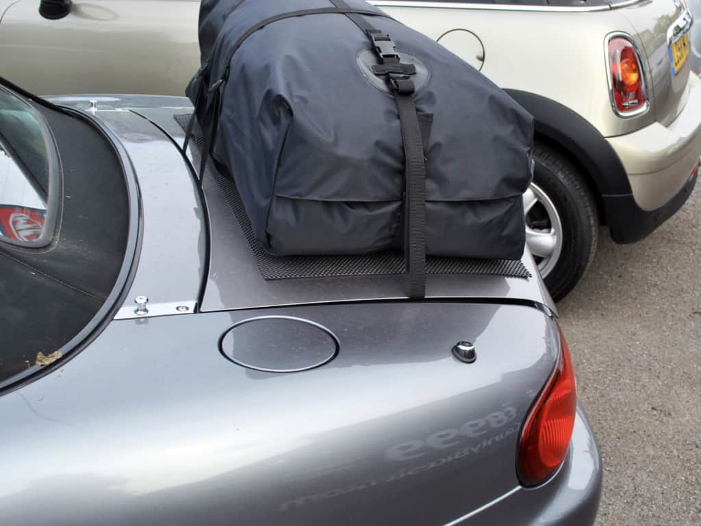 silver mazda mx5 mk2 with a boot-bag vacation luggage rack fitted