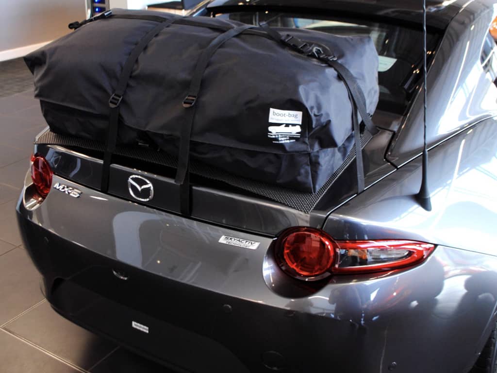 grey mazda mx5 rf with a boot-bag vacation luggage rack fitted