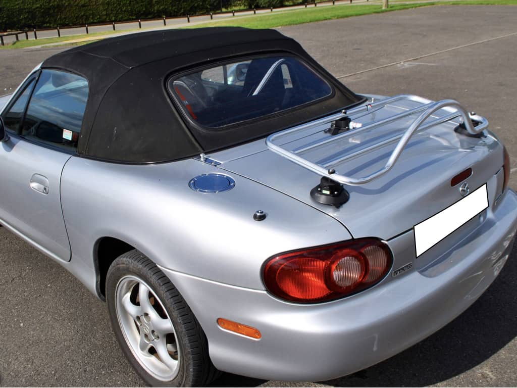 rear view of a silver mx5 mk2 with a revo-rack stainless steel luggage rack fitted