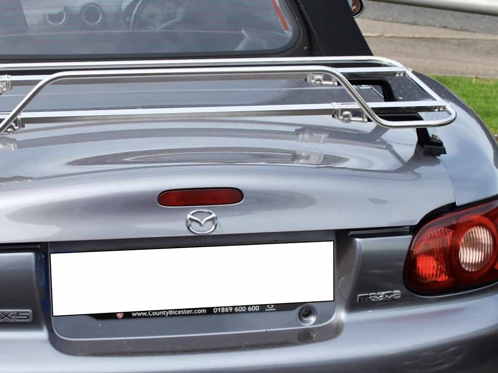 close up of a stainless steel luggage rack fitted to a dark silver mk2 mazda mx5