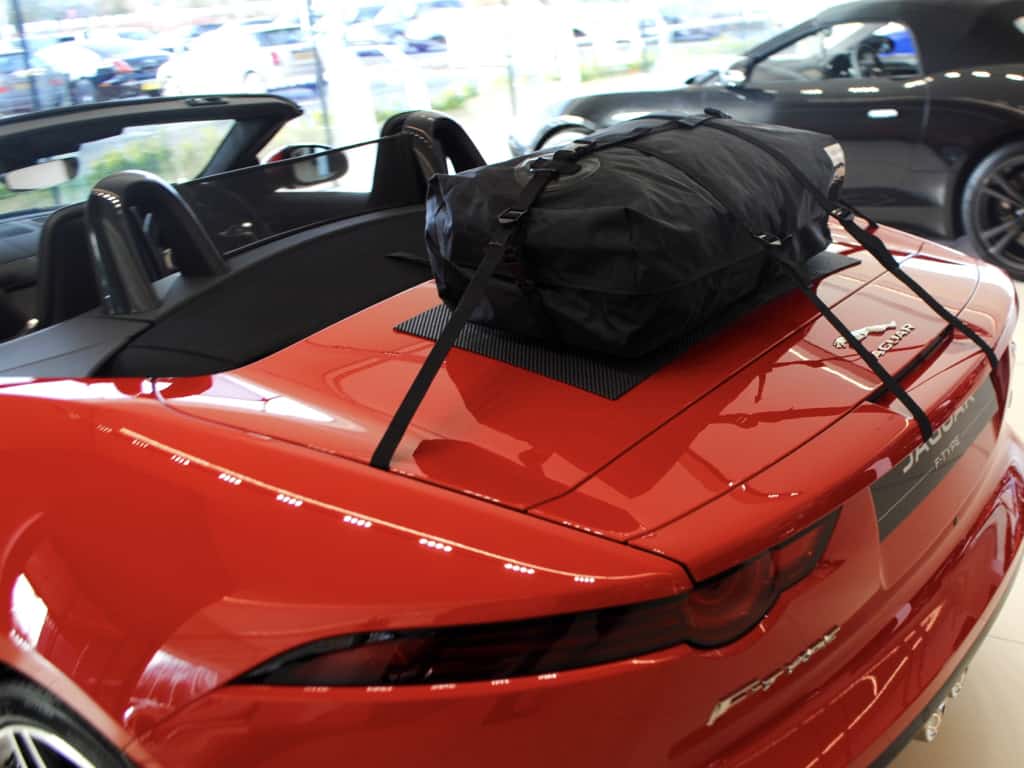 red jaguar f type convertible with a boot-bag original luggage rack fitted