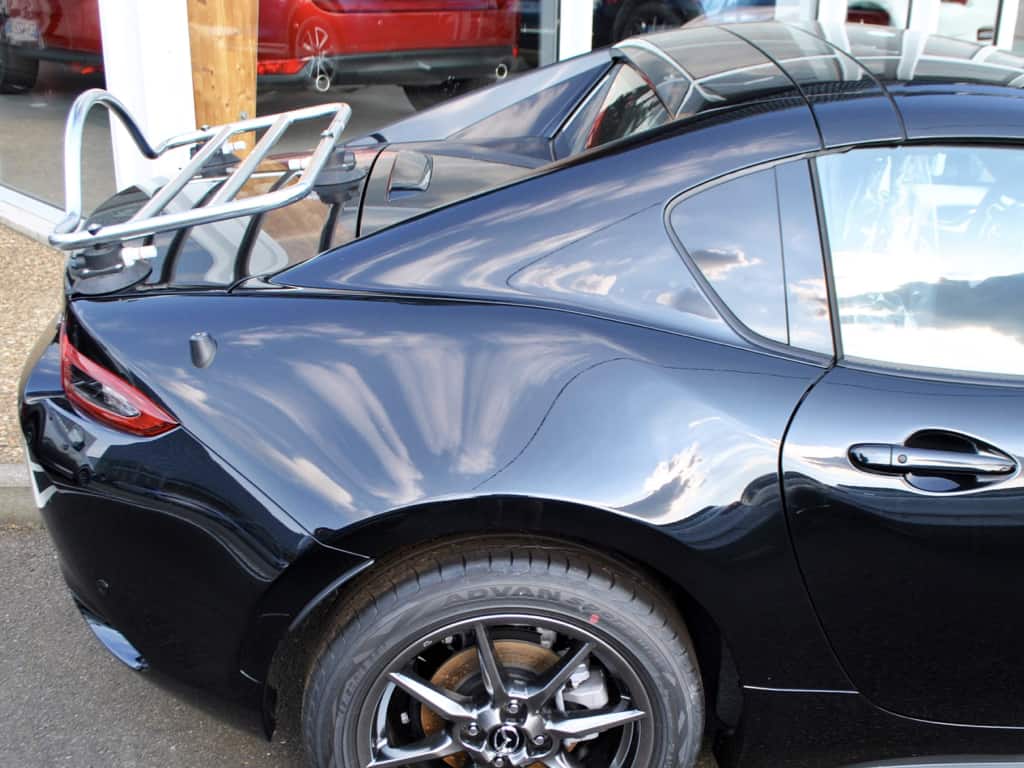 side view of a mazda mx5 rf in black with a revo-rack pa luggage rack fitted