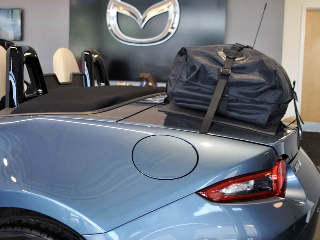 side view of a blue mx5 mk4 with a boot-bag luggage rack fitted 