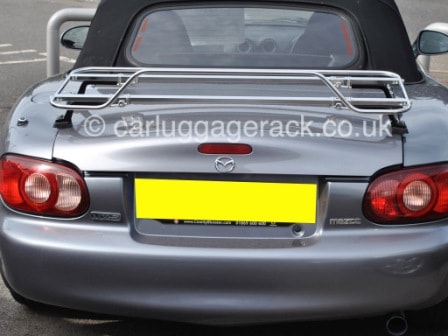 dark grey mazda mx5 mk2 with a black hood and a stainless steel luggage rack fitted