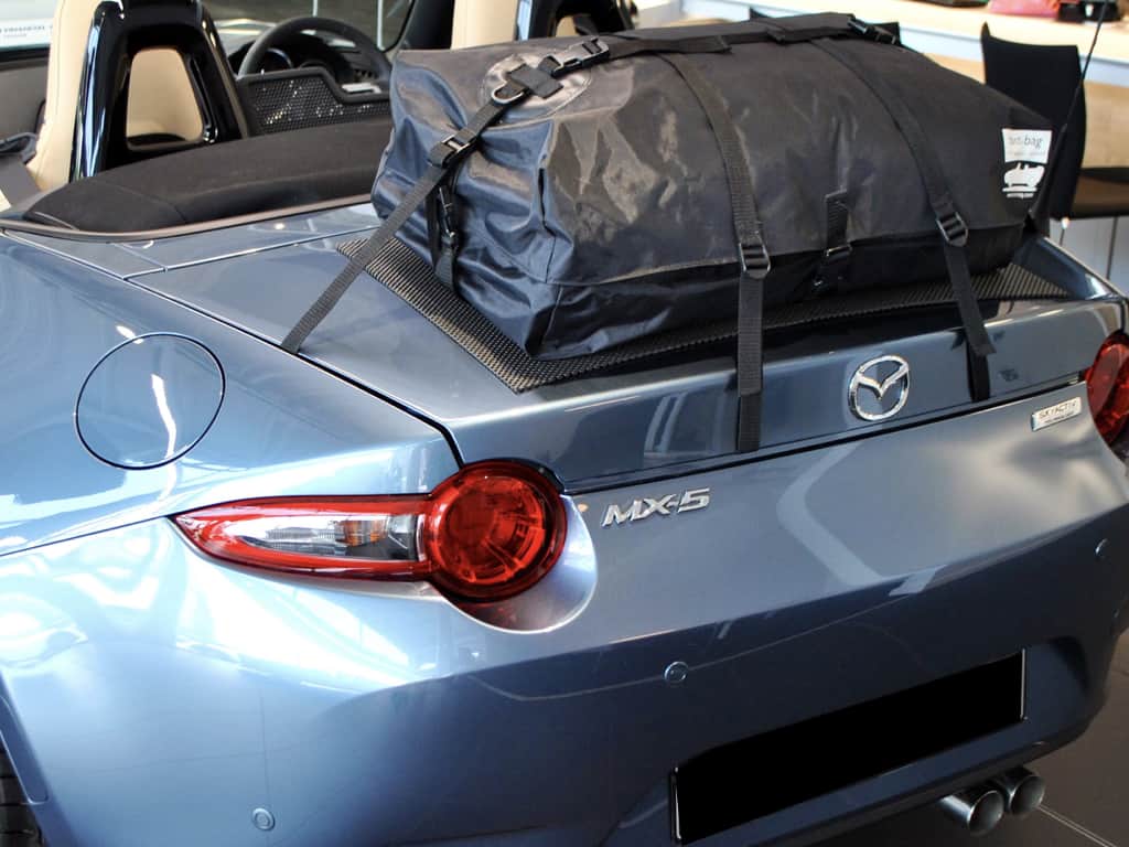 Rear view of a mazda mx5 mk4 with a boot-bag luggage rack fitted
