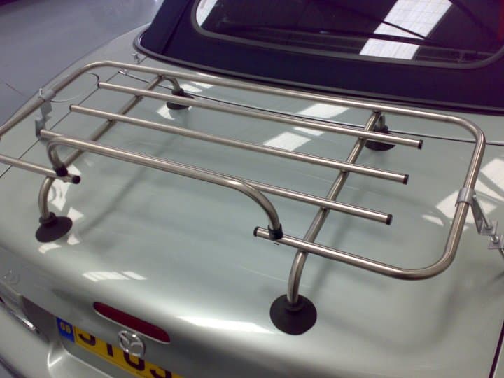 silver mazda mx5 mk2 with a chrome luggage rack fitted photographed from above