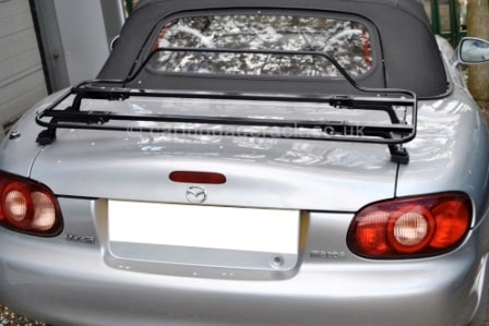 silver mazda mx5 mk1 with a black luggage rack fitted