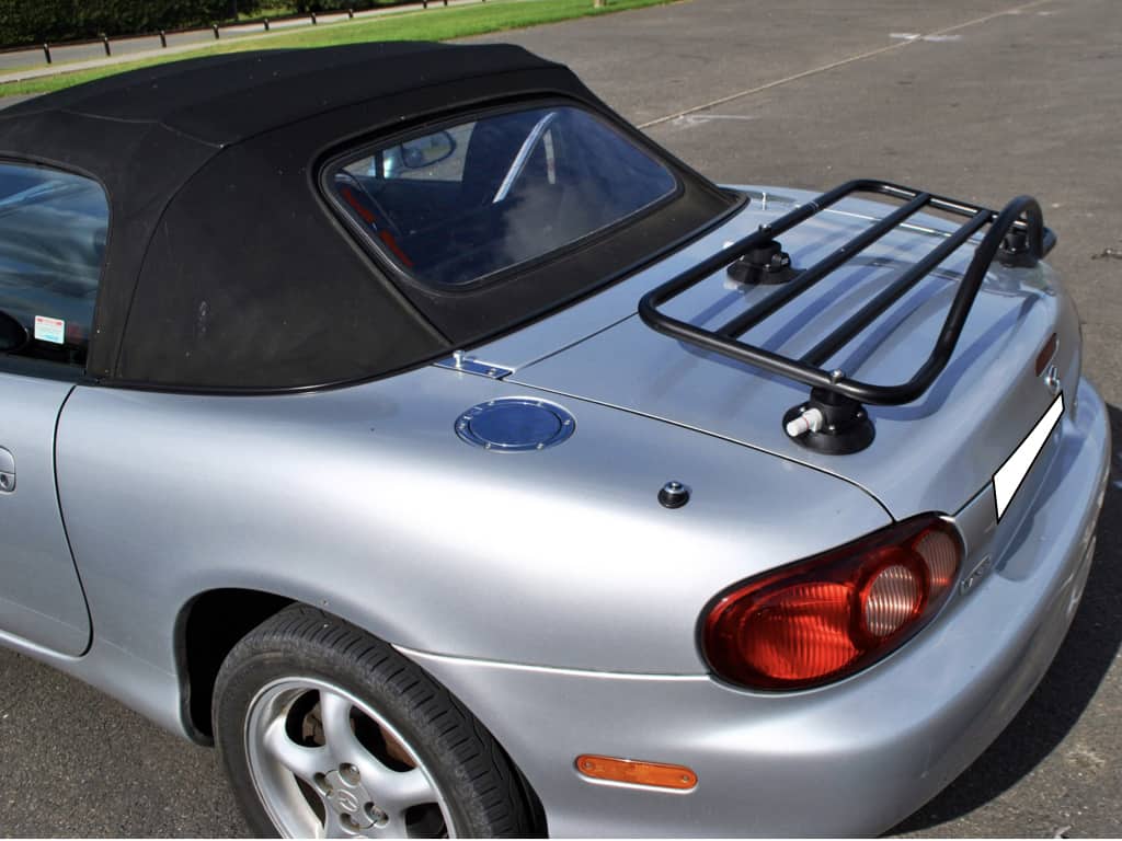 side view of a revo-rack black luggage rack fitted to a silver mx5 mk2