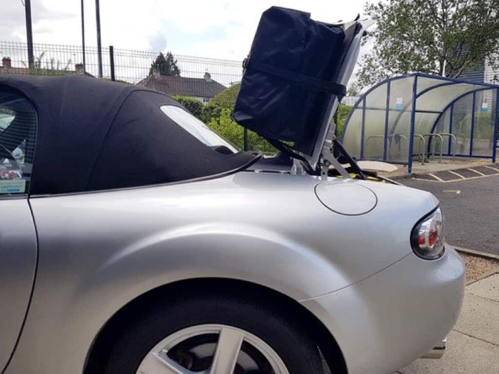 Side view of a boot-bag vacation luggage rack fitted to a mazda mx5 mk3