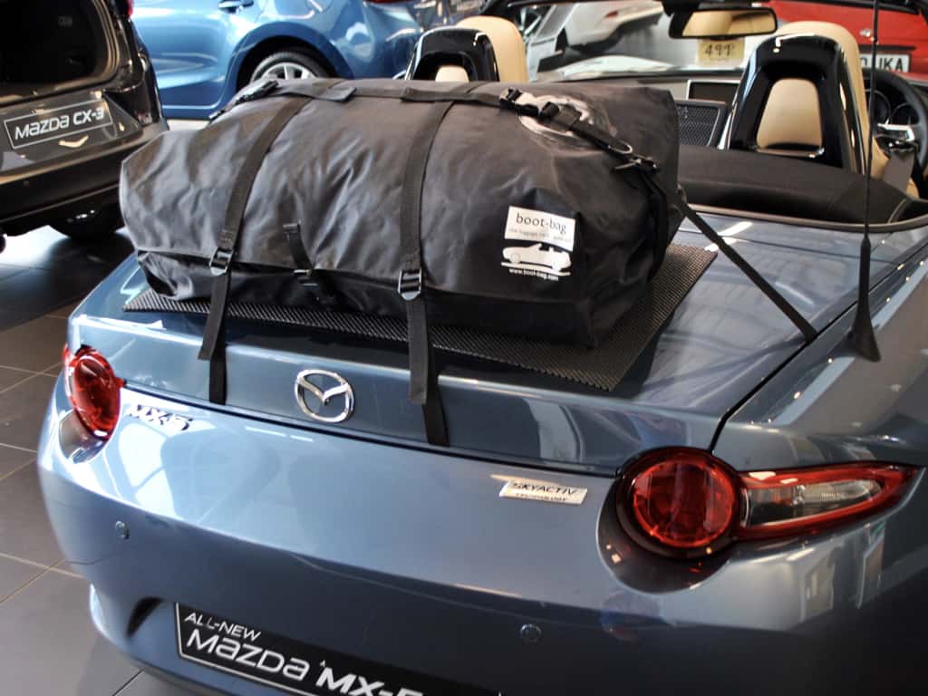 blue mazda mx5 mk4 with a boot-bag original luggage rack fitted
