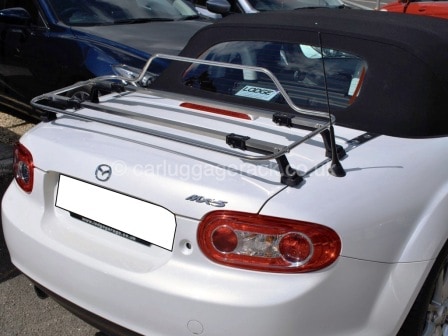 white mazda mx5 mk3 with a stainless steel luggage rack fitted