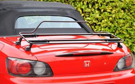 rear view of a red honda s2000 with a black luggage rack fitted