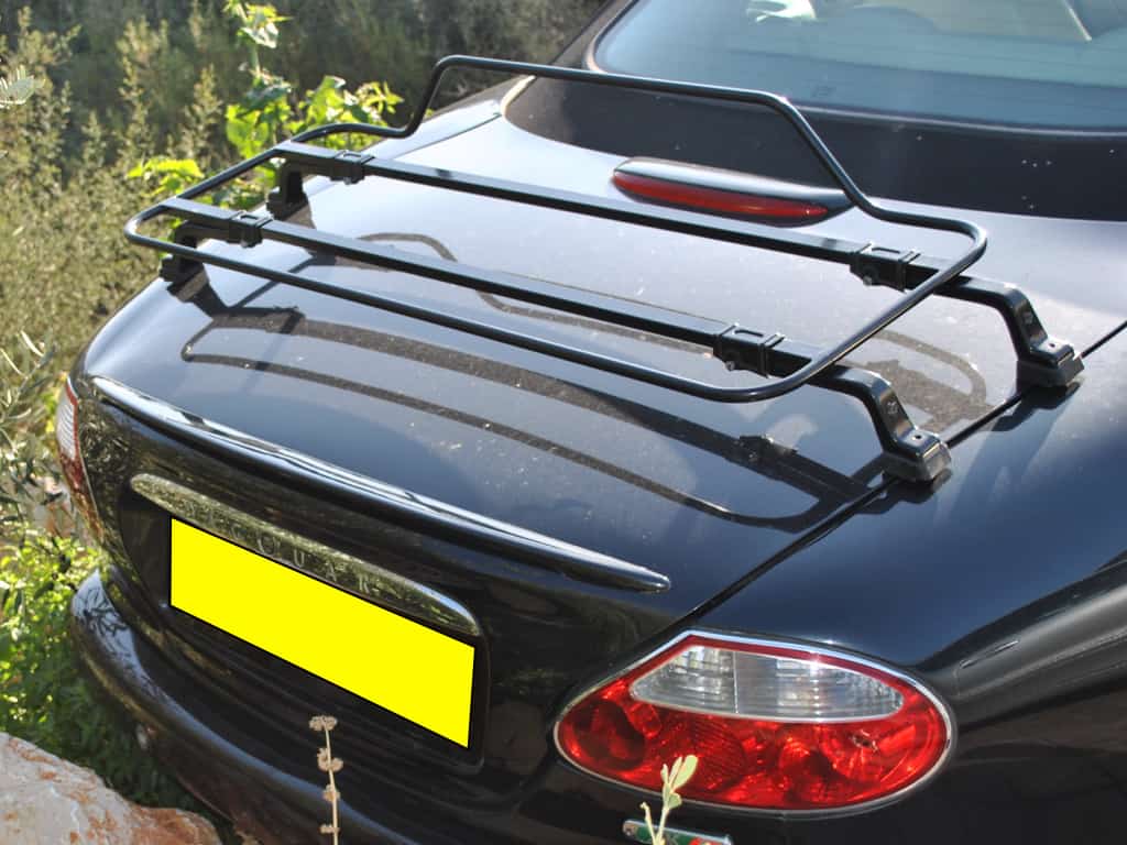 black jaguar xk8 convertible with a black luggage rack fitted