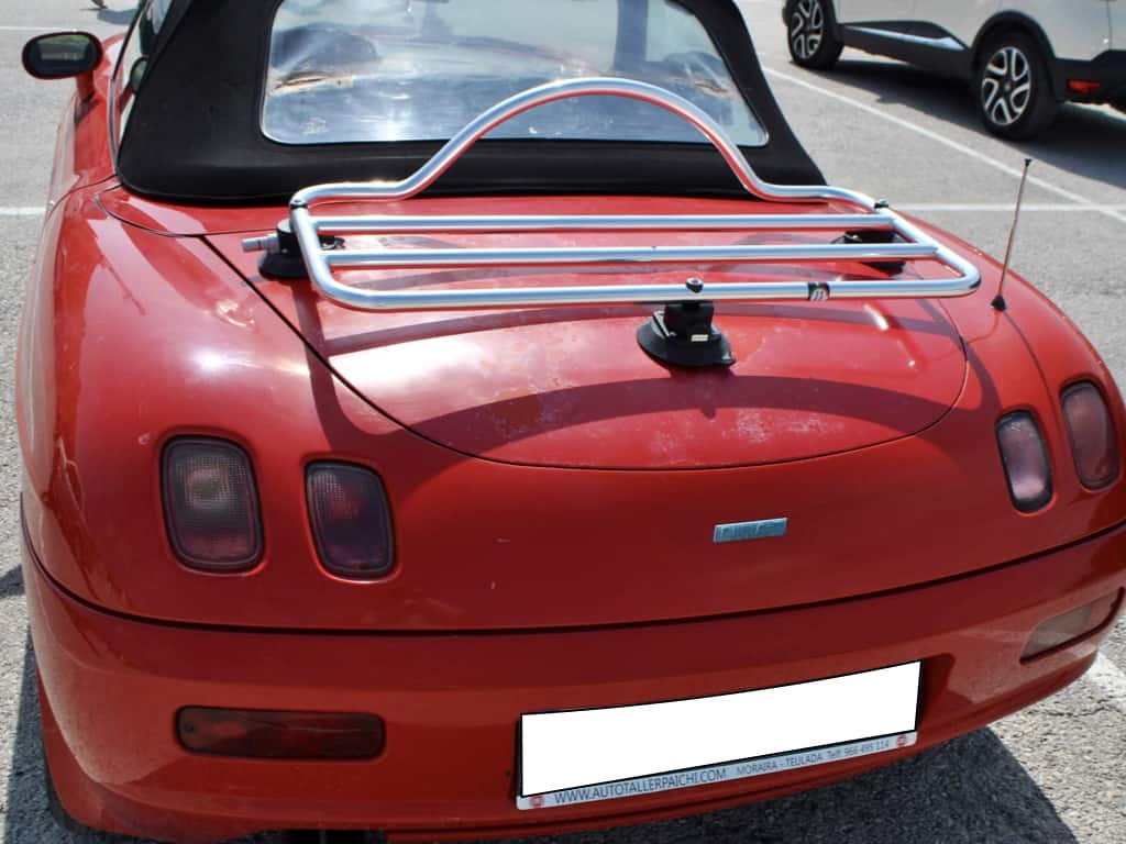 red fiat barchetta with a revo-rack pa luggage rack fitted photographed from behind