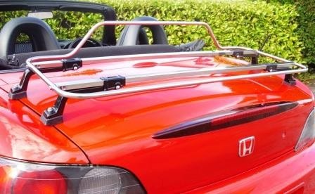 red honda s2000 hood down with a stainless steel luggage rack fitted