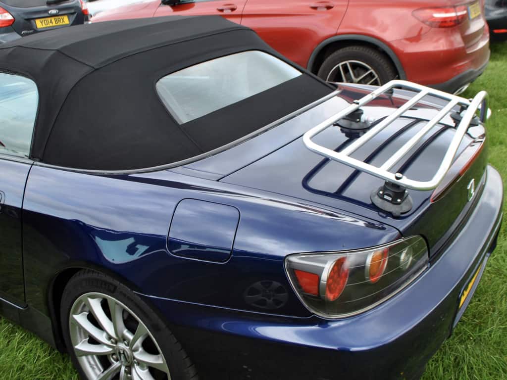 dark blue honda s2000 with the hood up and a revo-rack pa luggage rack fitted to the boot 