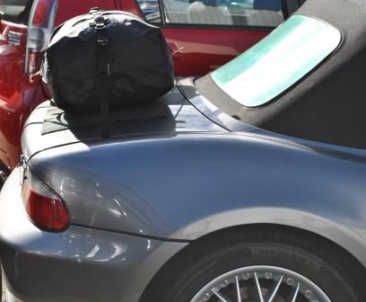 side view of a graphite bmw z3 with a boot-bag original luggage rack fitted