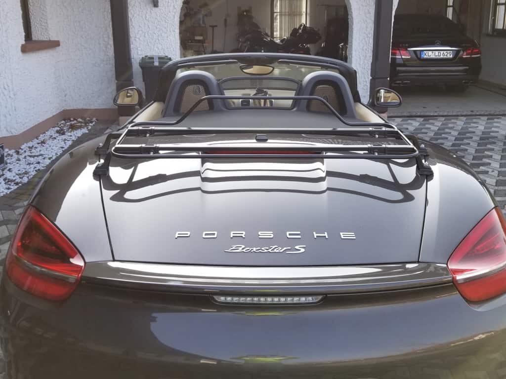 rear view of a 981 porsche boxster with a black luggage rack fitted
