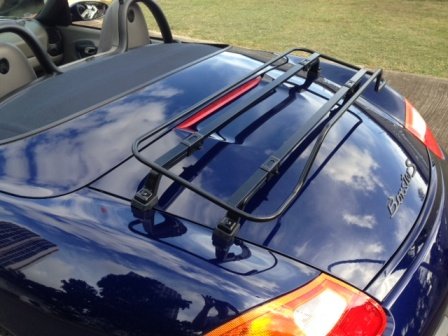 dark blue 986 porsche boxster s with a black luggage rack fitted