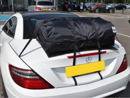 white mercedes benz r172 2011-16 with a boot-bag vacation luggage rack fitted to the boot