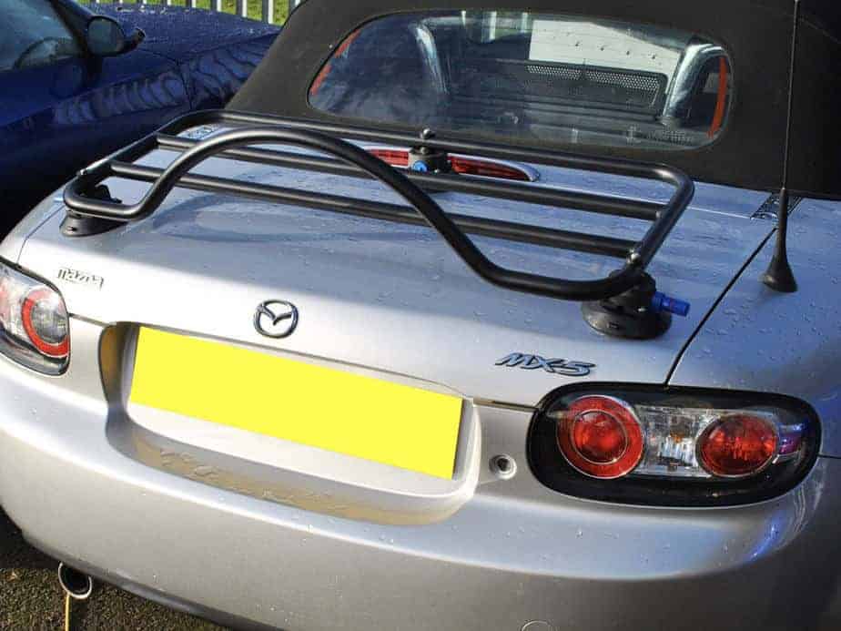 silver mazda mx5 mk3 fabric roof soft top with a black revo-rack luggage rack fitted