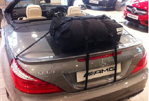 dark grey mercedes sl r231 with a boot-bag original luggage rack fitted in a mercedes showroom
