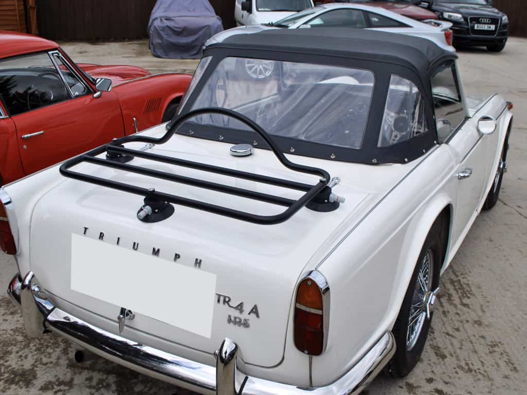 white triumph tr4 with a revo-rack black luggage rack fitted