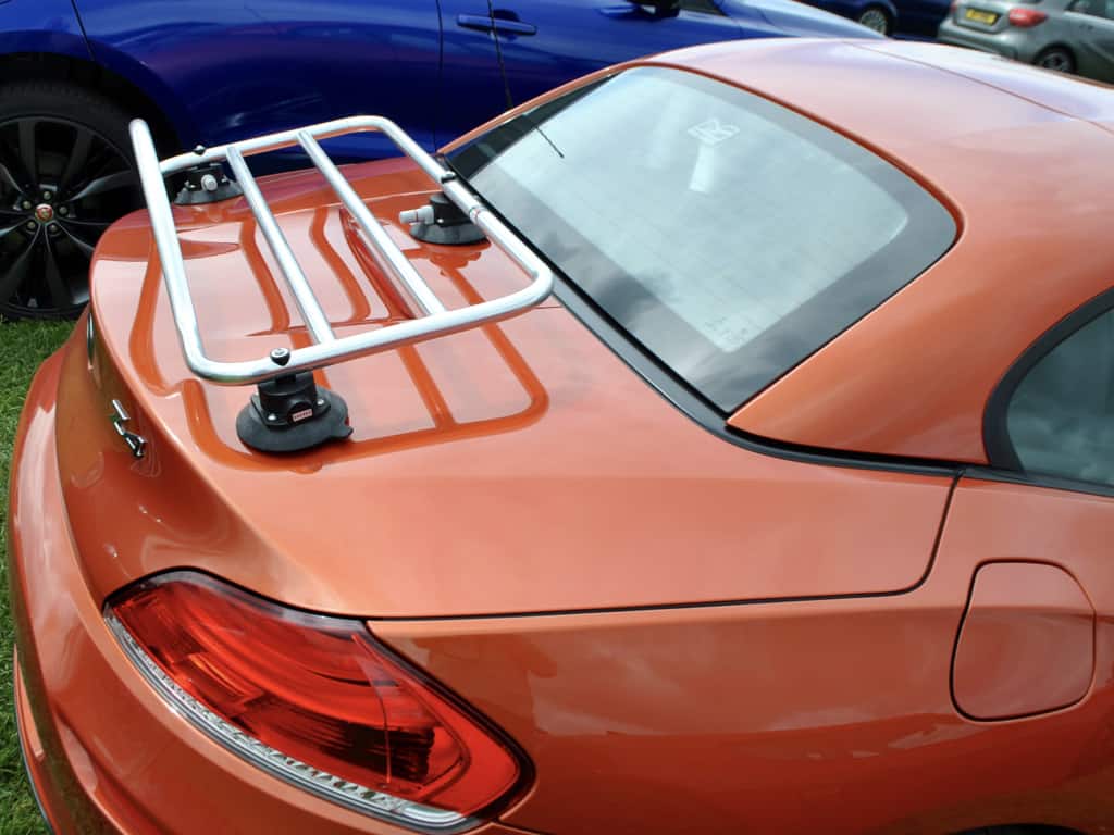 side view of a bmw z4 e89 in orange with a revo-rack luggage rack fitted