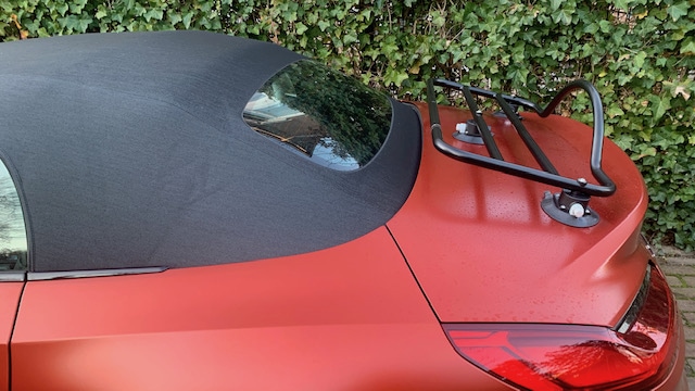 side view of a bronze bmw z4 with a revo-rack black luggage rack fitted