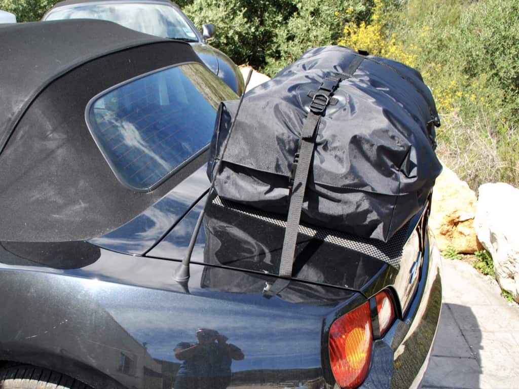 side view of a boot-bag vacation luggage rack fitted to a bmw z4 e85 in black