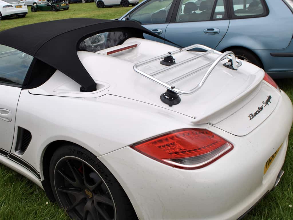 white 987 boxster spider with a chrome luggage rack fitted